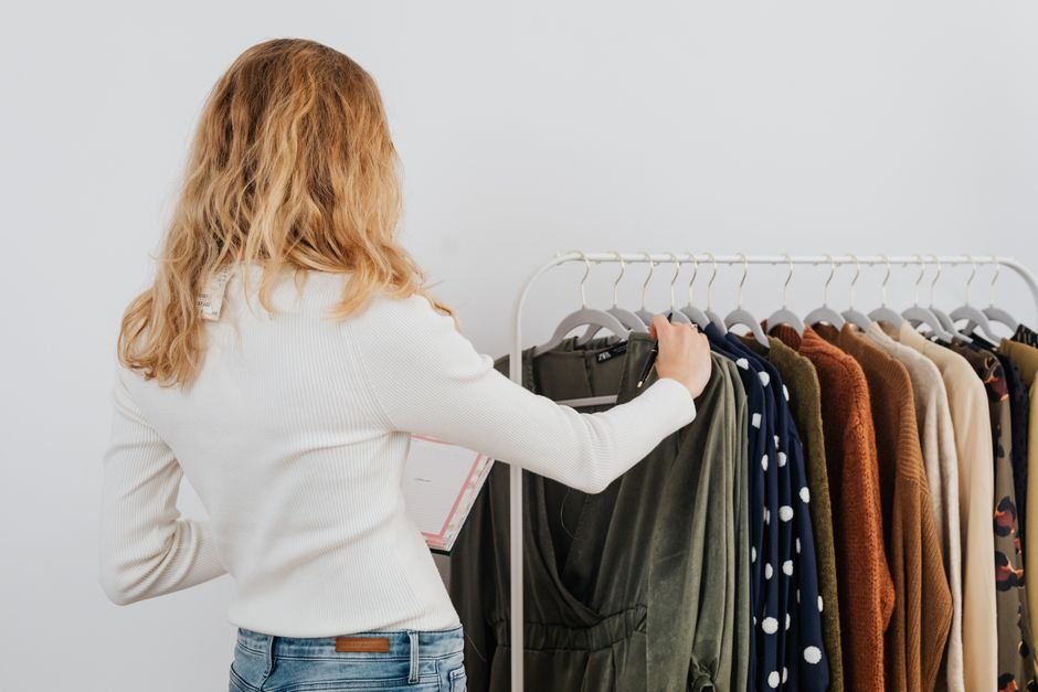 person browsing clothing rack