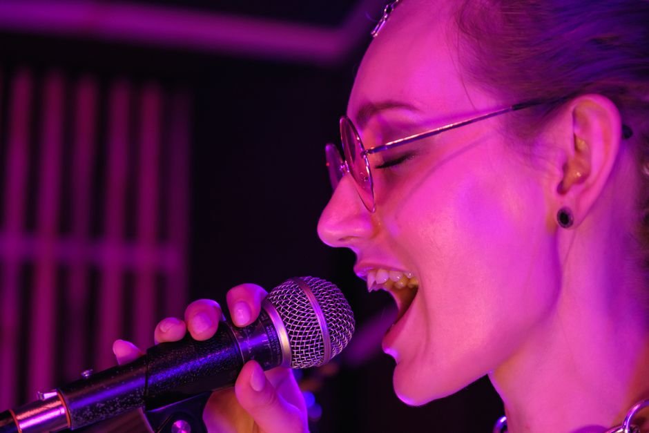 person singing into microphone