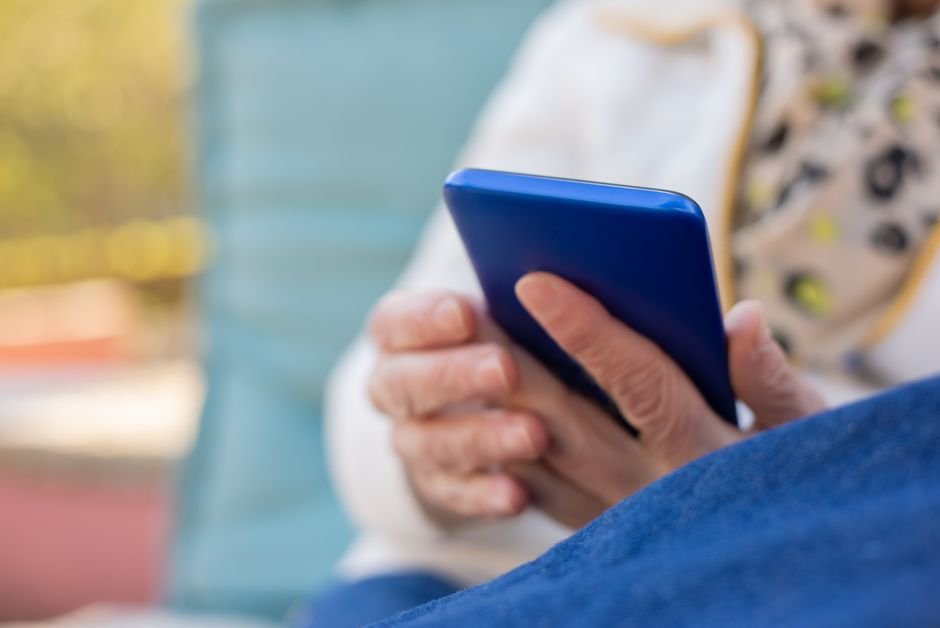 senior hands using smartphone