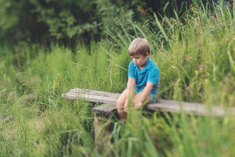 quiet child sitting alone