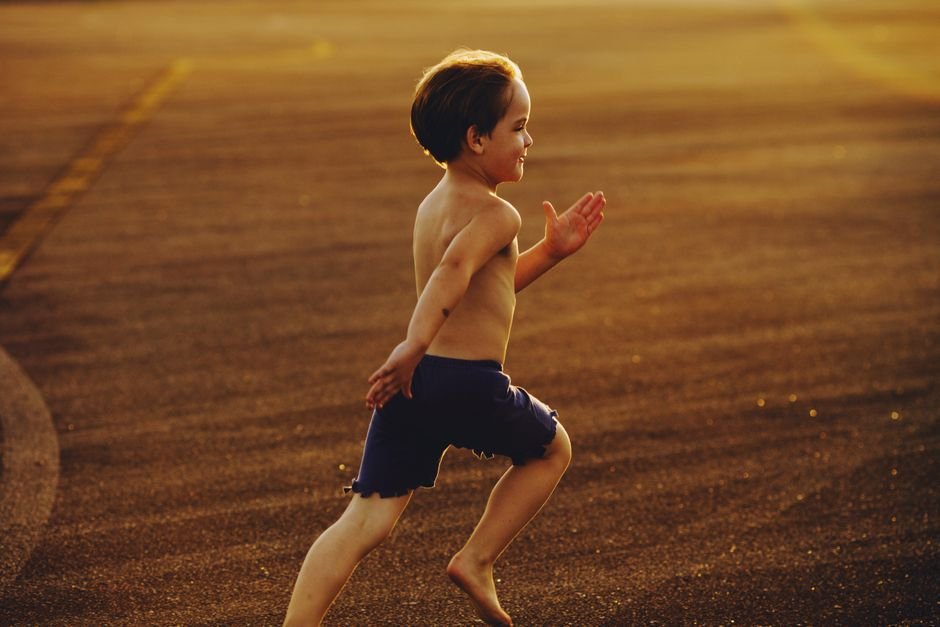 energetic child running outdoors