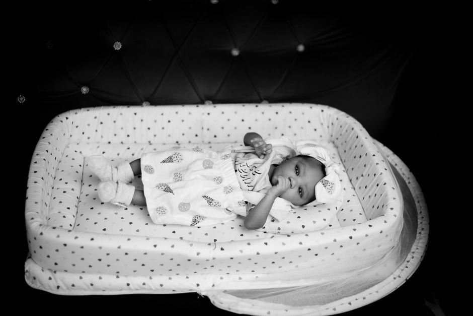 newborn baby sleeping crib